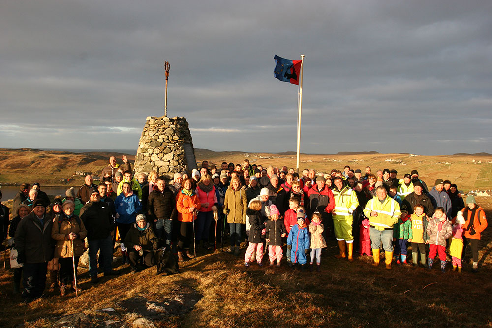 Our Carloway Community below the Carloway flag